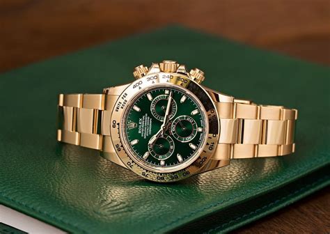 rolex with a green face.